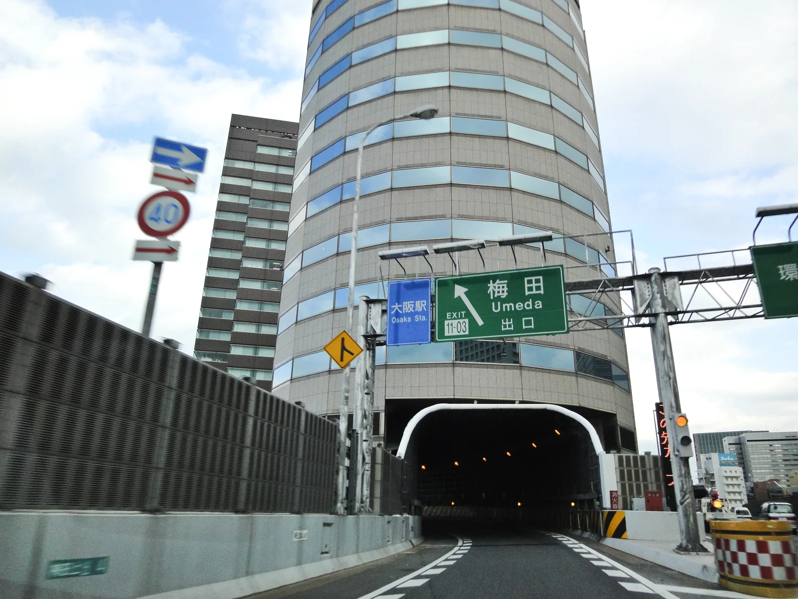 The Umeda exit ramp entering an opening in Osaka's Gate Tower Building, photographed in 2010